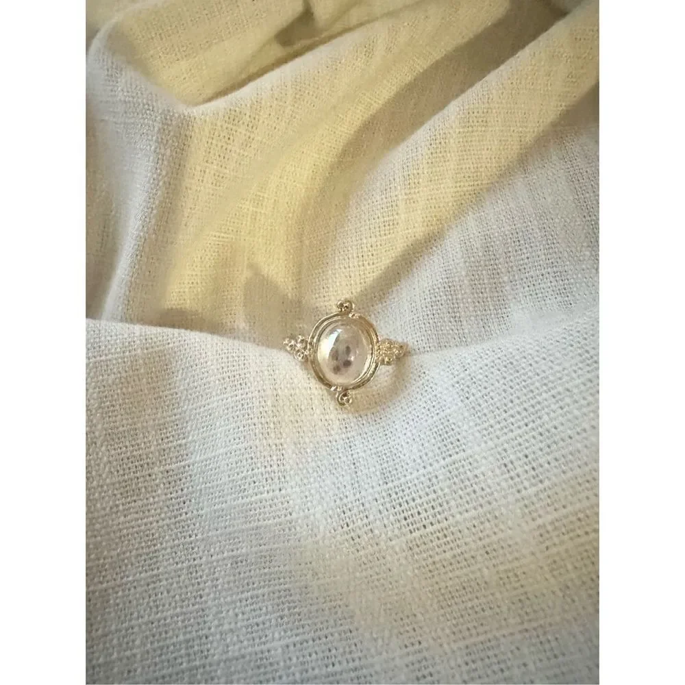 Size 8 oval cut iridescent ring